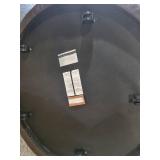 A Modern Round Brown Leather Coffee Table / Ottoman by Room and Board.