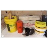 Assorted Fishing and Boating Gear Including Buckets, Life Jackets, and Propeller