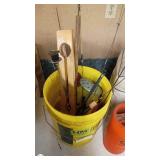 Assorted Fishing and Boating Gear Including Buckets, Life Jackets, and Propeller
