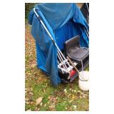 Portable ice house with Blue Canopy and variety of finshing tools