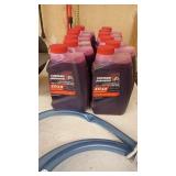 Marine Lot with 12 Evinrude Johnson XD30 Oil, Propeller, and Hose