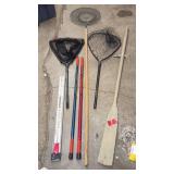 Fishing and Boating Accessory Lot with Nets, Poles, and Oar