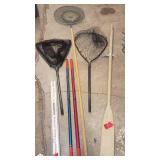 Fishing and Boating Accessory Lot with Nets, Poles, and Oar