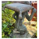 Metal Garden Statue of Kneeling Man Carrying Sack