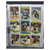 Binder with Assorted Vintage Minnesota Vikings Football Cards and Minnesota North Star Hockey Cards