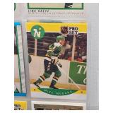 Binder with Assorted Vintage Minnesota Vikings Football Cards and Minnesota North Star Hockey Cards