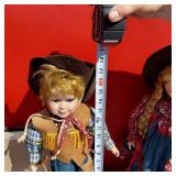 Western Cowboy and Cowgirl Porcelain Dolls, Each approximately 16 inches tall