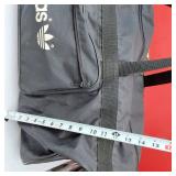 Adidas Black Duffel, Grey Gym Bag, Blue Carry-On, and Red Tote Bag.