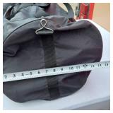 Adidas Black Duffel, Grey Gym Bag, Blue Carry-On, and Red Tote Bag.