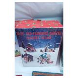 Christmas Decorative Items including Nesting Boxes, Angel Tree Top and Small Lighted Country Village