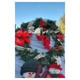 Lot of Christmas Decorations including Wreath, Snowman Figures, and Angel Topper