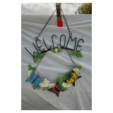 Welcome Sign with Butterfly Design, Santa Figurine, and Assorted Decorative Items