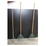 Large Assortment of Lawn and Garden Tools Including Rakes, Shovels, Hoes, and Brooms