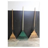 Large Assortment of Lawn and Garden Tools Including Rakes, Shovels, Hoes, and Brooms