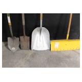 Large Assortment of Lawn and Garden Tools Including Rakes, Shovels, Hoes, and Brooms