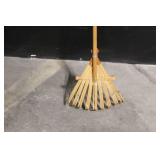 Large Assortment of Lawn and Garden Tools Including Rakes, Shovels, Hoes, and Brooms