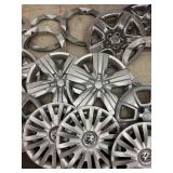 Collection of Assorted Plastic Hubcaps and Wheel Covers