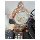 Collection of Xfinity Modems, Cisco Cable Boxes, USB Charger, Remotes, and Decorative Clock