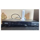 Collection of Xfinity Modems, Cisco Cable Boxes, USB Charger, Remotes, and Decorative Clock