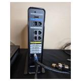 Collection of Xfinity Modems, Cisco Cable Boxes, USB Charger, Remotes, and Decorative Clock