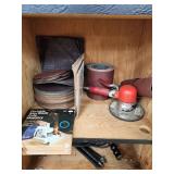 Cabinet with Power Tools, Circular Saws, Sanders, and Sandpaper Rolls
