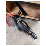 Cabinet with Power Tools, Circular Saws, Sanders, and Sandpaper Rolls