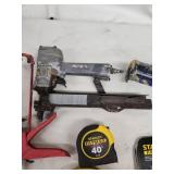 Mixed Lot of Caulking Guns, Tape Measures, Stanley Hand Saw, and Pneumatic Tools
