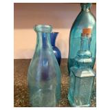 Collection of 7 Blue and Aqua Glass Bottles and Vases