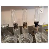 Collection of Vintage Glass Oil Lamps, Crystal Glassware, and Salt Shakers