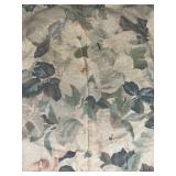 Green Wicker Armchair with Floral Cushion