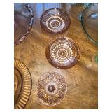 Vintage Glassware Collection Including Pink Depression Glass Plates and Green Bakeware