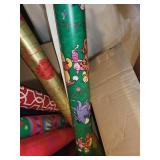Collection of Holiday Wrapping Paper Rolls and Wooden Santa Holder