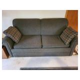 Pull-Out Sofa Bed with Plaid Accent Pillows