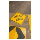 Collection of Used Roadway Traffic Signs Including Dead End and Directional Arrows