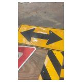 Collection of Used Road Signs Including Yield and Directional Arrows