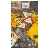 Collection of Vintage Metal Road Signs including Dead End, Yield, and Stop Ahead