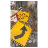Collection of Vintage Metal Road Signs including Dead End, Yield, and Stop Ahead