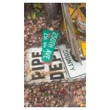 Collection of Vintage Road Signs and License Plates