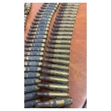 Linked Belt of Spent Brass Rifle Casings