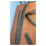 Linked Belt of Spent Brass Rifle Casings