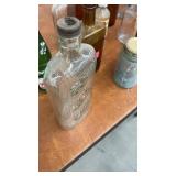 Collection of Vintage Glass Bottles and Jars