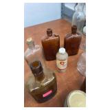 Collection of Vintage Glass Bottles and Jars