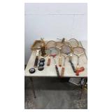 Vintage Tennis Racket Collection with Hockey Pucks and Trophy