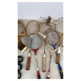 Vintage Tennis Racket Collection with Hockey Pucks and Trophy