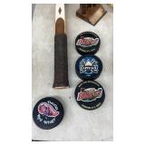 Vintage Tennis Racket Collection with Hockey Pucks and Trophy