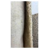 Collection of Assorted Rolled Carpets and Remnants