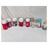 Collection of Vintage Thermo Bottles Featuring ALF, Barbie, Raggedy Ann, Mr. T, Garfield, Lazer Tag, and Holly Hobbie