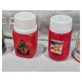 Collection of Vintage Thermo Bottles Featuring ALF, Barbie, Raggedy Ann, Mr. T, Garfield, Lazer Tag, and Holly Hobbie