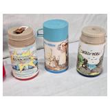 Collection of Vintage Thermo Bottles Featuring ALF, Barbie, Raggedy Ann, Mr. T, Garfield, Lazer Tag, and Holly Hobbie