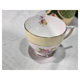 Assorted Vintage and Decorative Ceramics and Clock, Madame Alexander Peter Pan, Covington Stonewear, Rosina bone china cup and saucer made in England, a Taylor & Kent cup, and a Maruhon ware pot from 